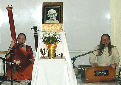 Parvati and Adam singing Raghupati Raghava - Click to see image of Gandhi © 2006 Adam C. Burke - Photo by Jacque Davis